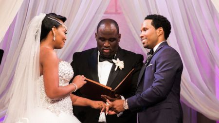 yandy and mendeecees infront of the pastor on wedding ceremony 
